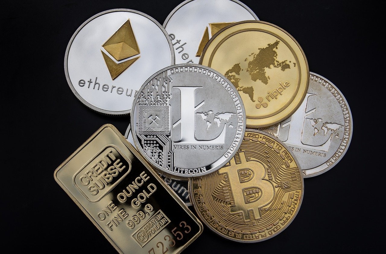 Various cryptocurrency symbols in coin form.
